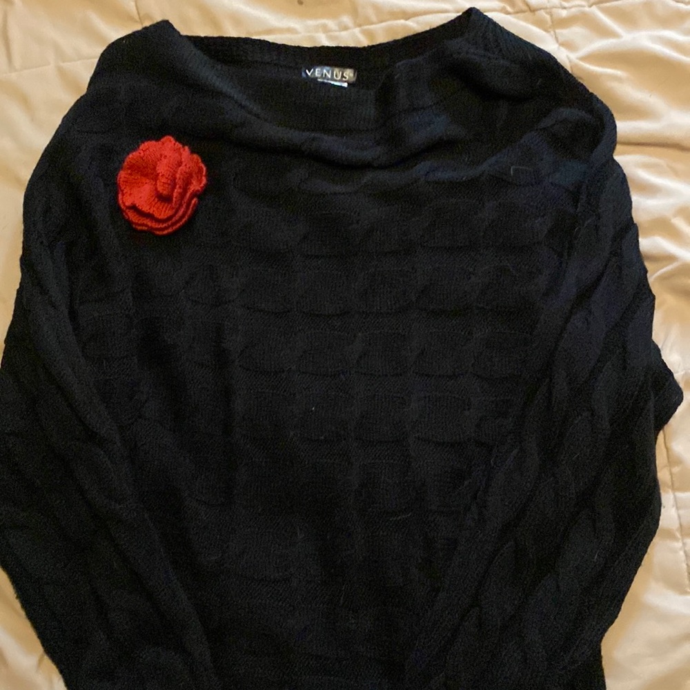 Black sweater with attached flower